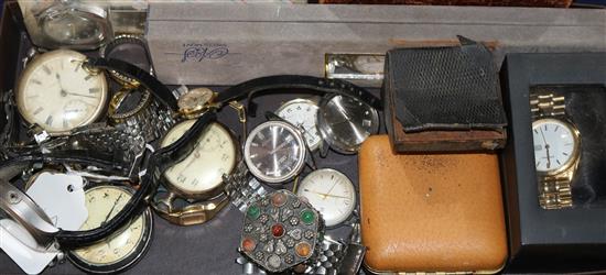 A group of assorted wrist watches and pocket watches.